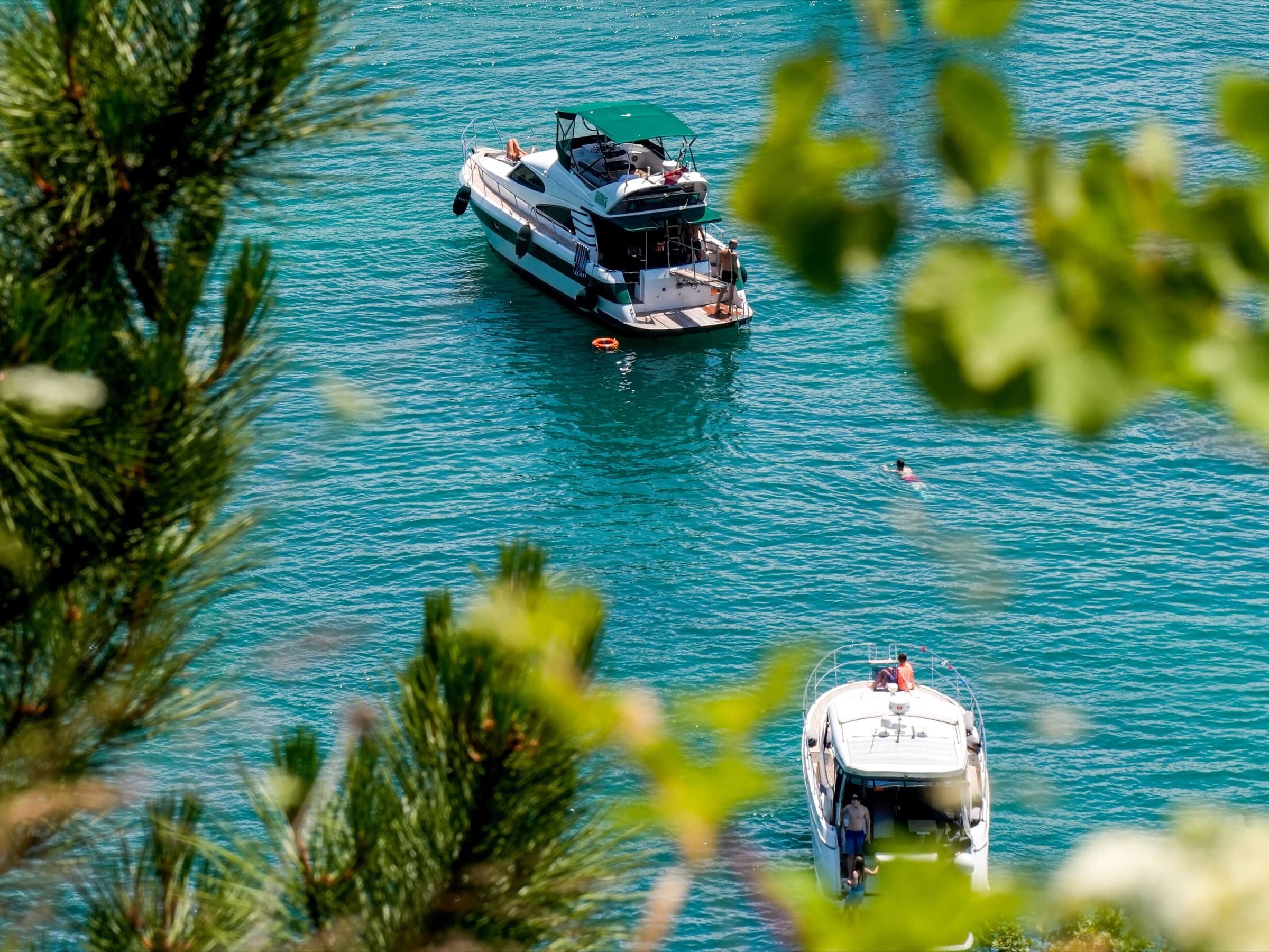 Motor yachts anchored in a quiet cove